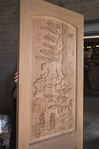 carved door mountain lion profile