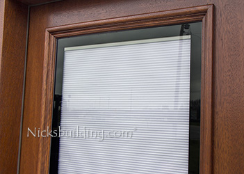 shades between glass wood doors